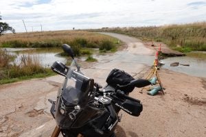 The scene of the drop with the Yamaha back on its wheels.