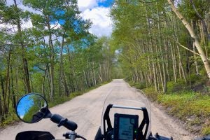 Aspens, rock walls and camped out overlanders are common sights along Boreas Pass, an easy dirt road ride that ends in Breckenridge.   Photo: Bill Roberson