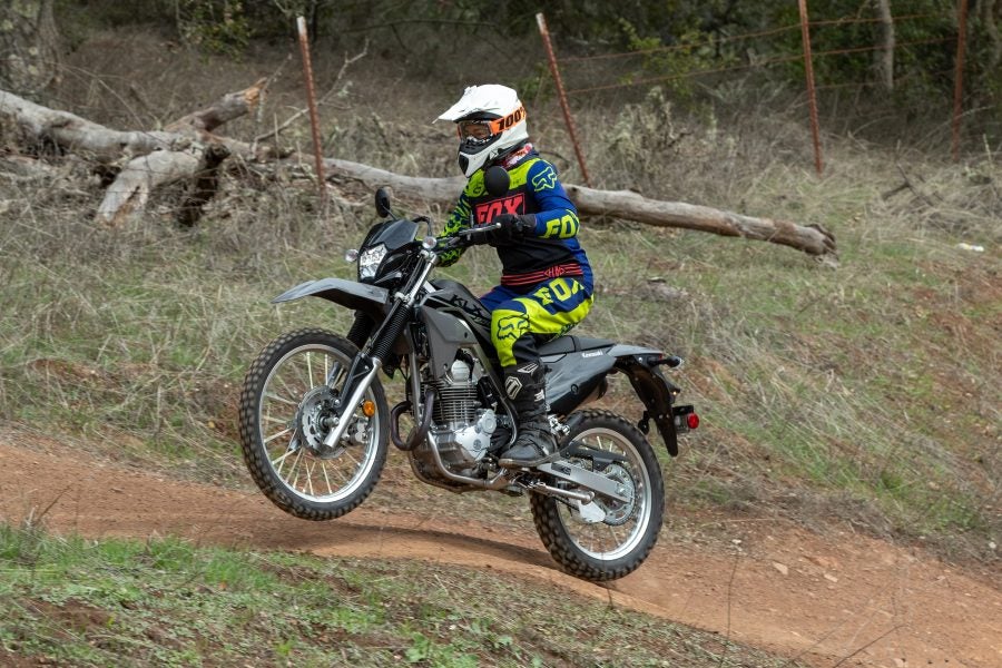 Catching some air on the 2023 KLX230S. Photos: Kevin Wing
