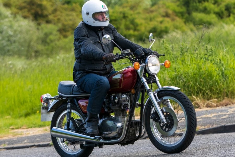 An XS650 looking like it's in good, unmodified condition tootles around rural England. These bikes are as well-suited to country back roads as their Brit bike counterparts. Photo: Sue Thatcher/Shutterstock.com